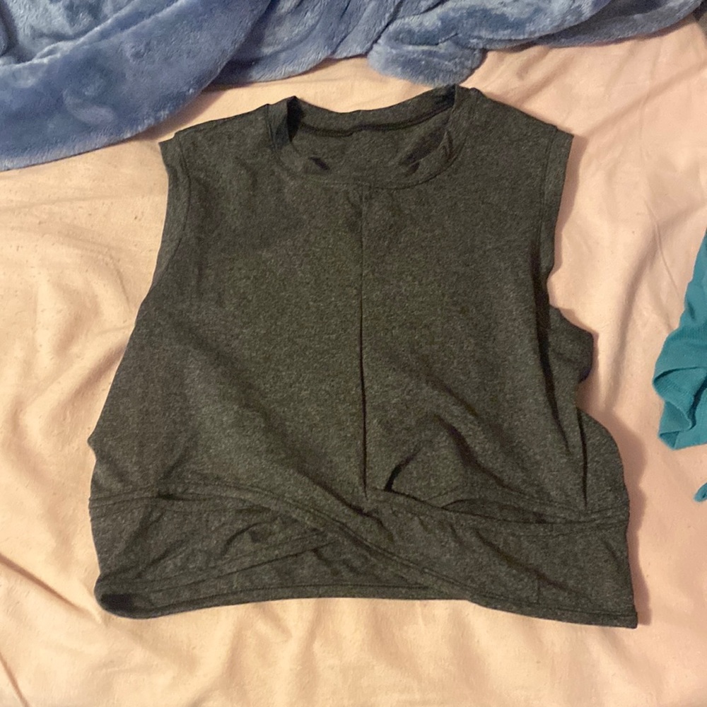 gray cropped athletic top with cross in the front